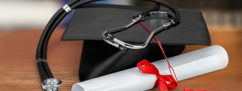 Graduation cap and diploma with stethoscope