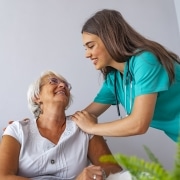 Nurse caring for elderly woman