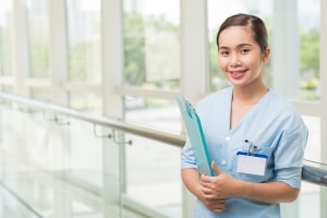 Smiling health professional in a hallway