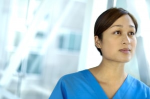 Nurse in scrubs looking forward