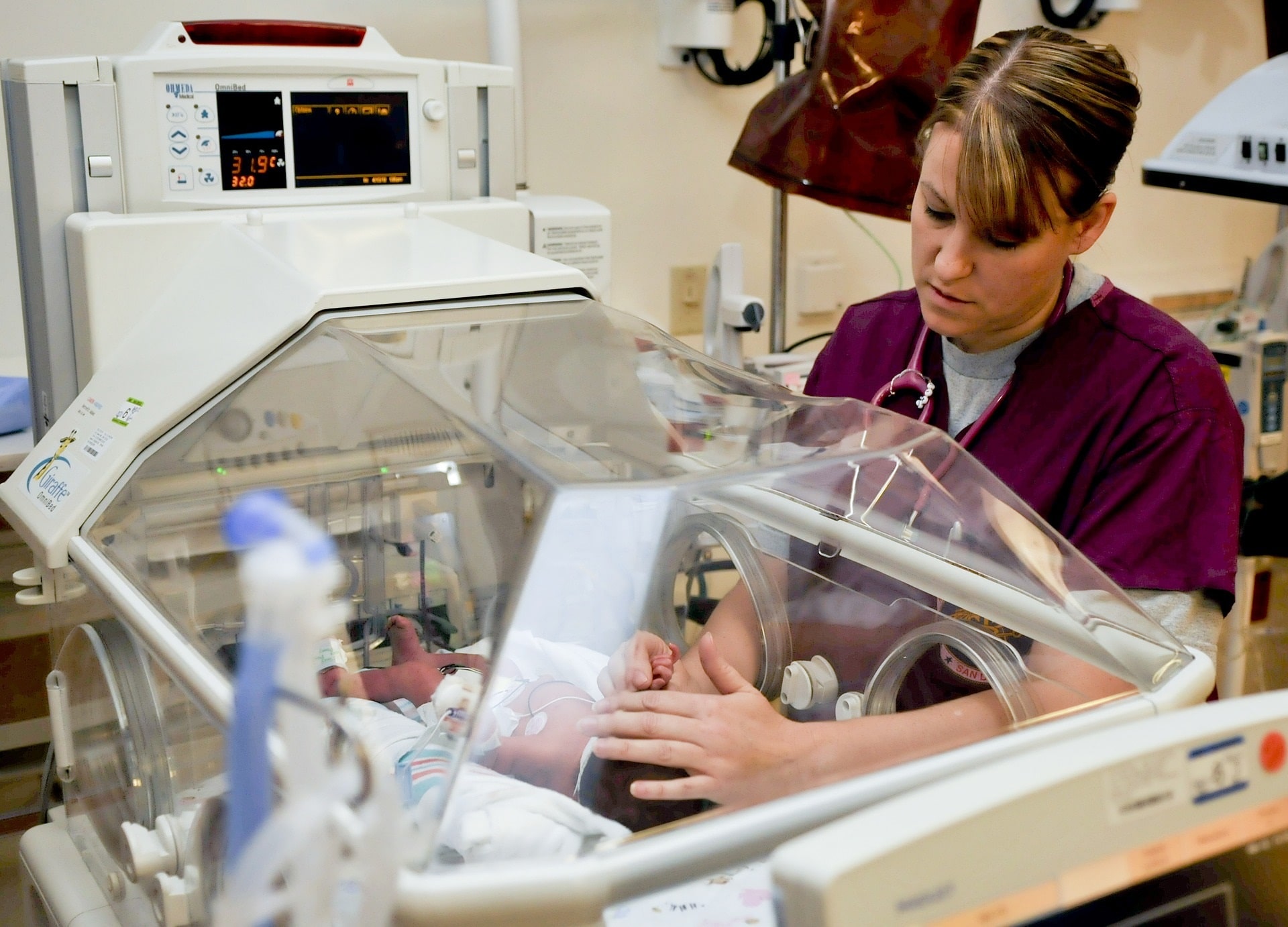 Neonatal nurse treating a newborn