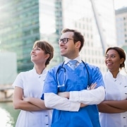 A team of nurses standing outside