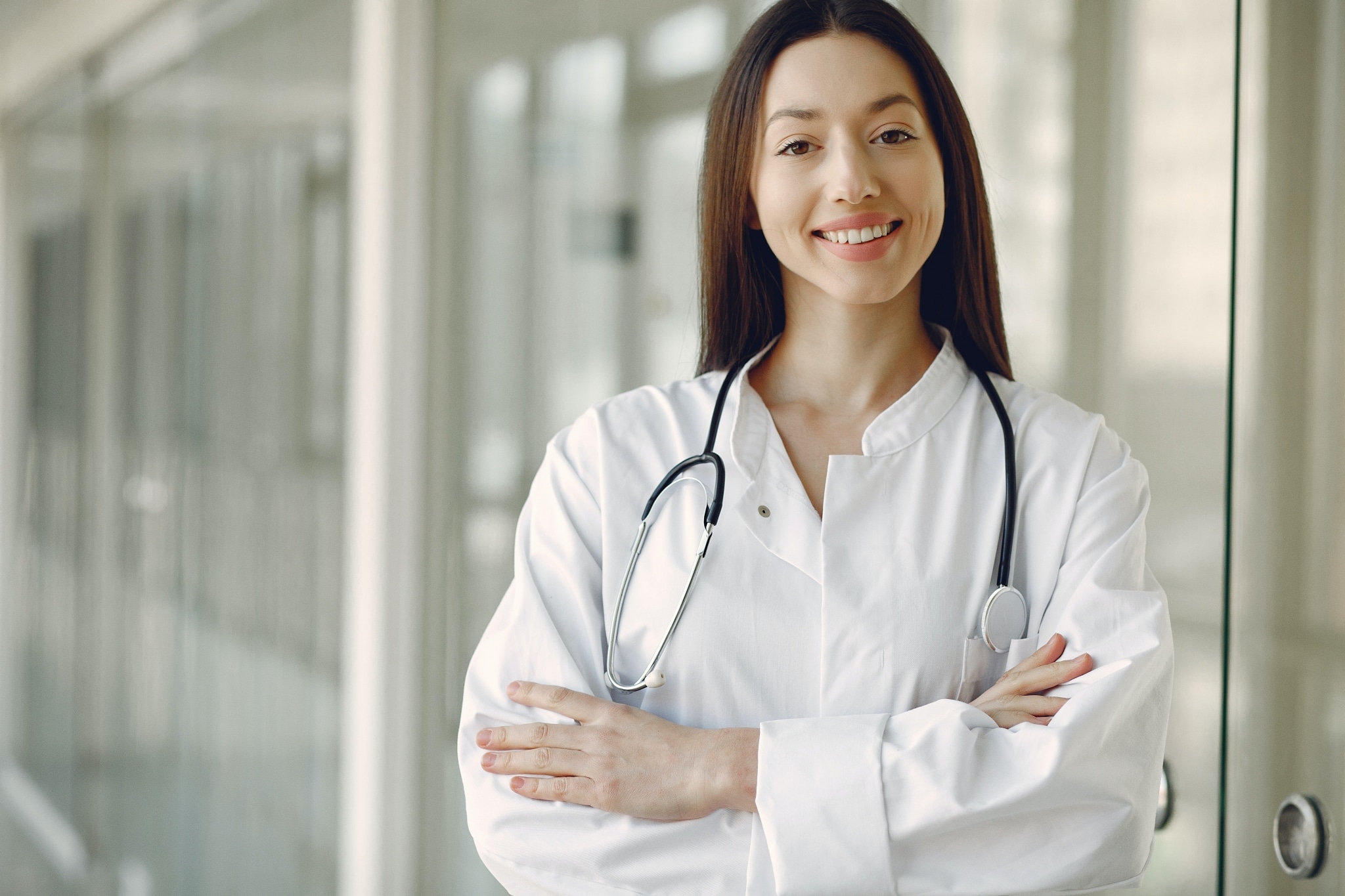 Smiling healthcare professional in a hallway