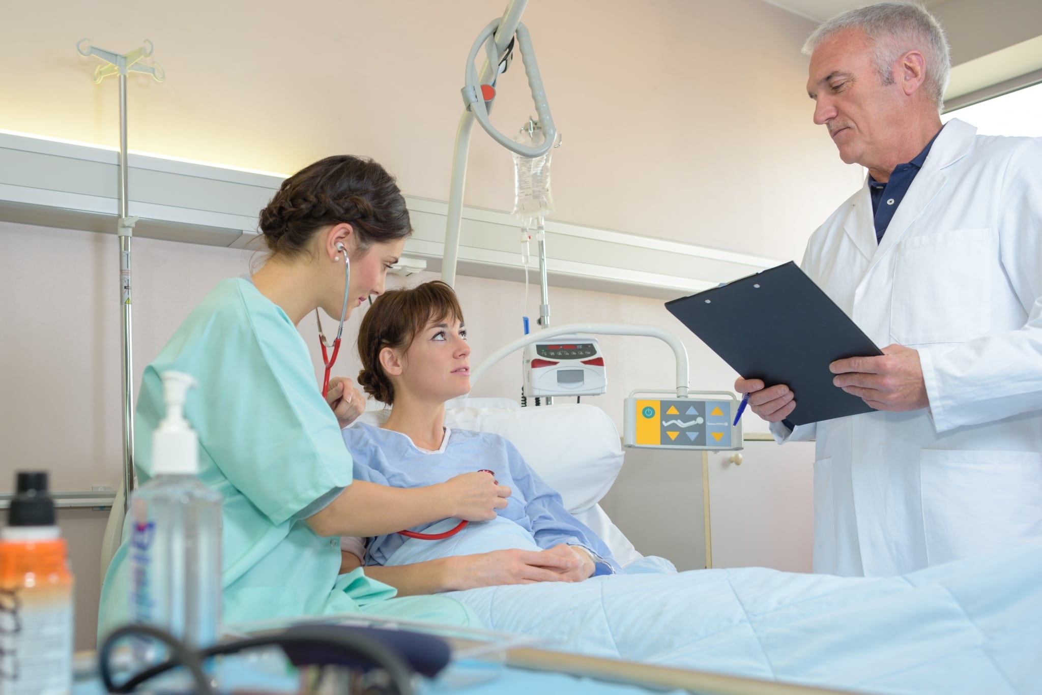 Medical Assistant with a doctor and a patient