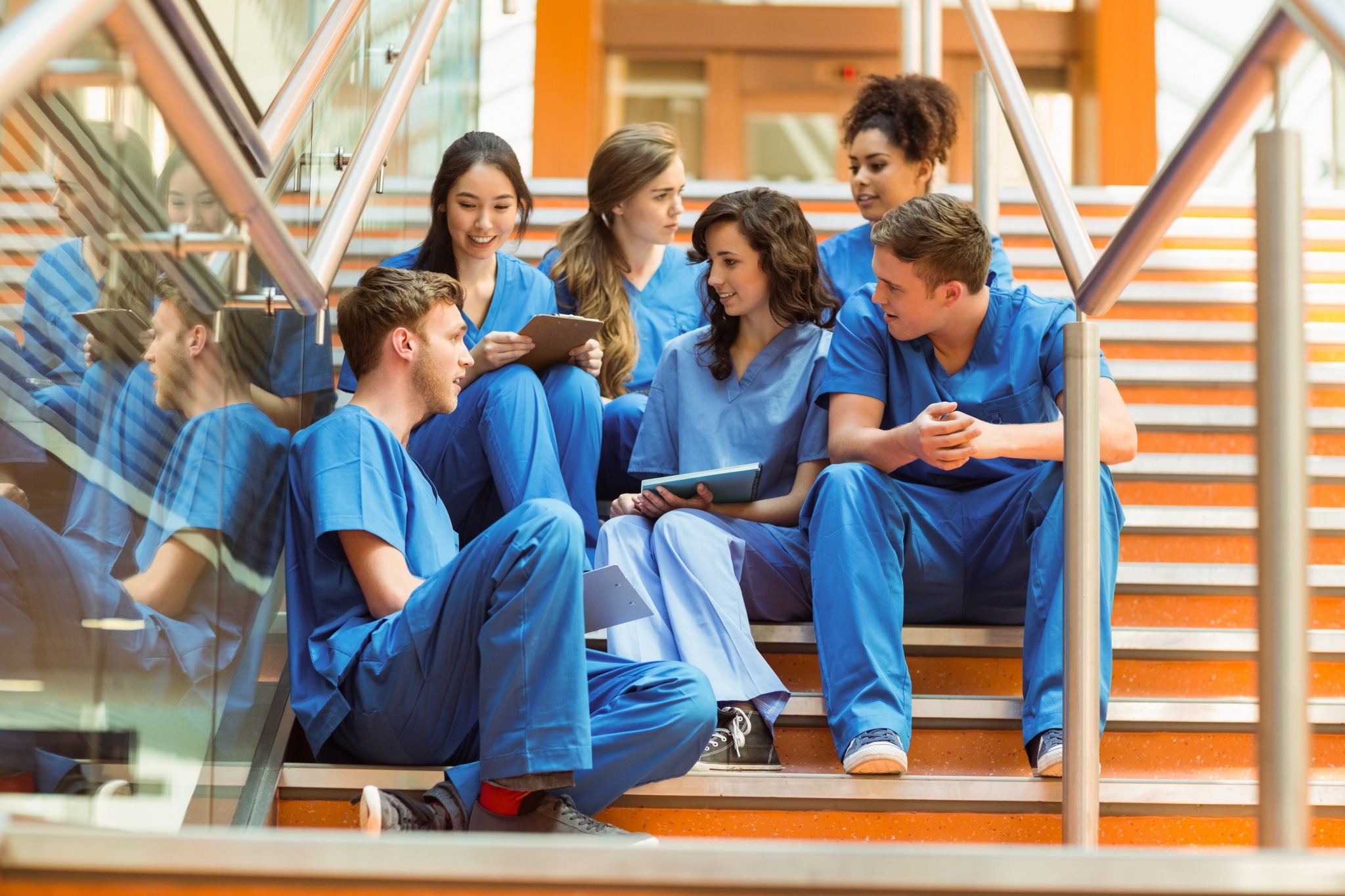 Medical students sitting on a staircase