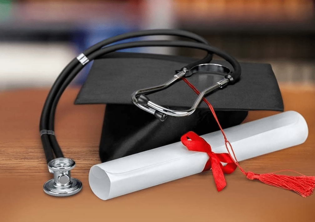 Graduate cap and diploma with a stethoscope