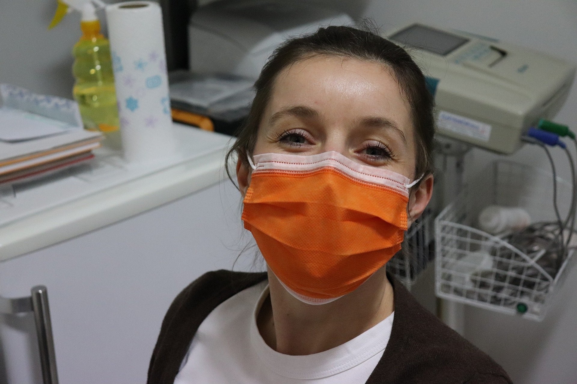 Medical professional in an orange mask