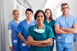 Medical professionals smiling in a hallway
