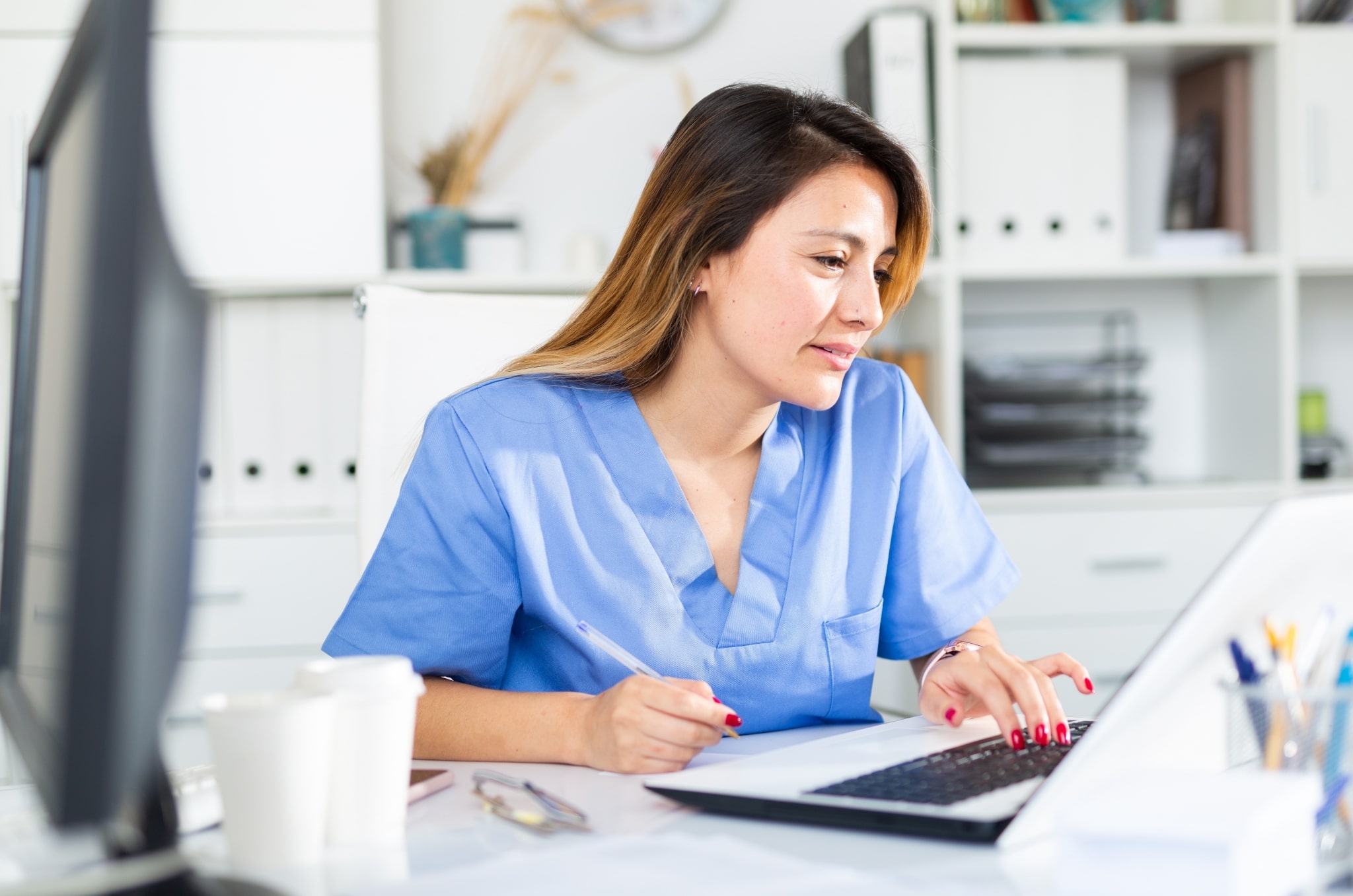 Medical professional on a laptop