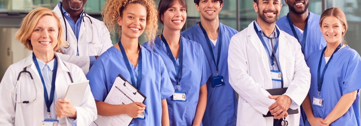 Smiling medical team outside a hospital