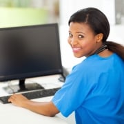 African-American nurse using a computer