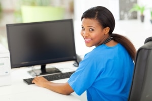 African-American nurse using a computer