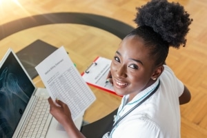 Healthcare professional holding paperwork