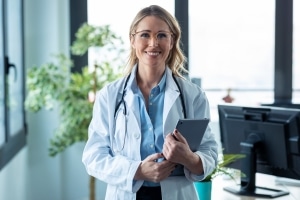 Attractive medical professional with clipboard