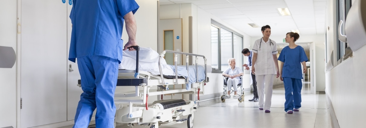 Healthcare professionals in a hospital hallway