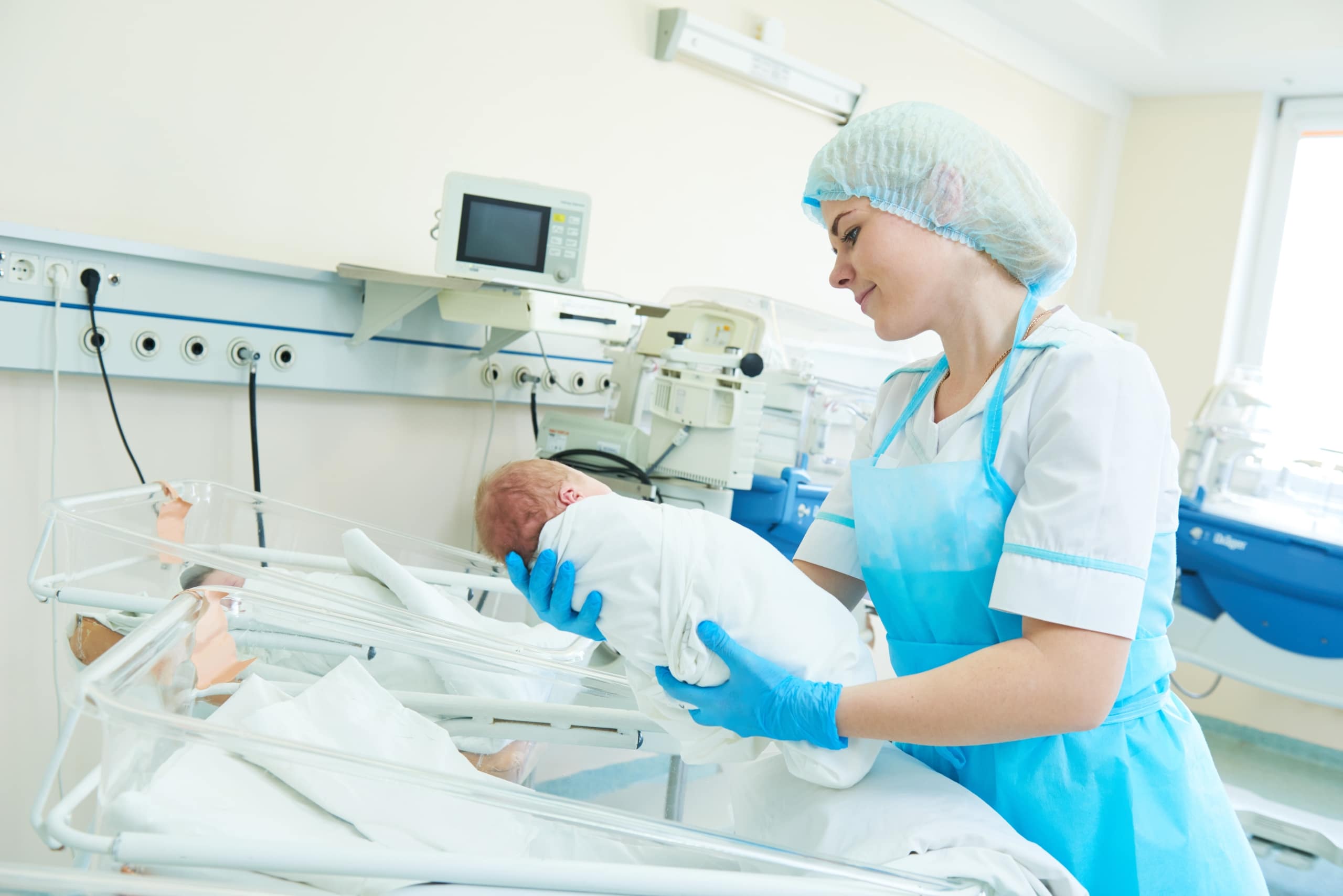 Medical professional with a newborn baby