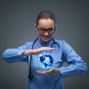 Travel nurse holding a virtual globe