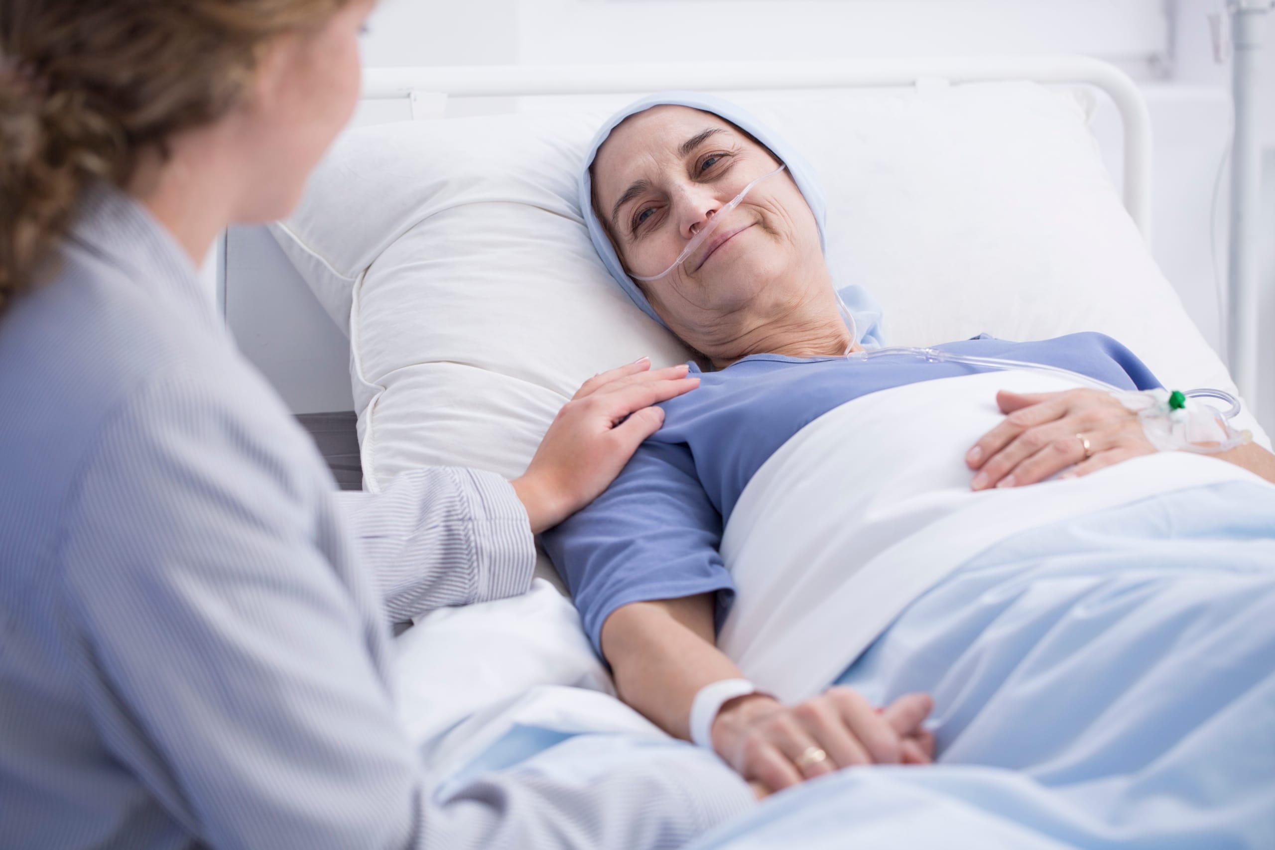 Nurse bedside with senior patient