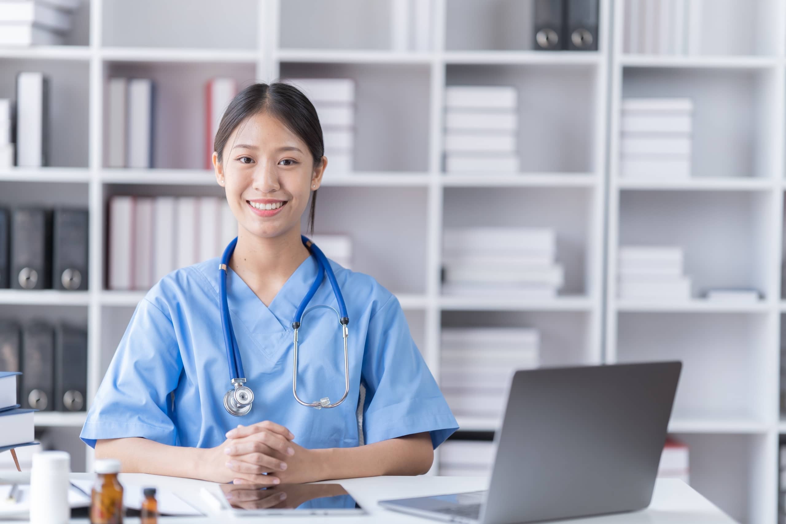Asian nurse at a desk