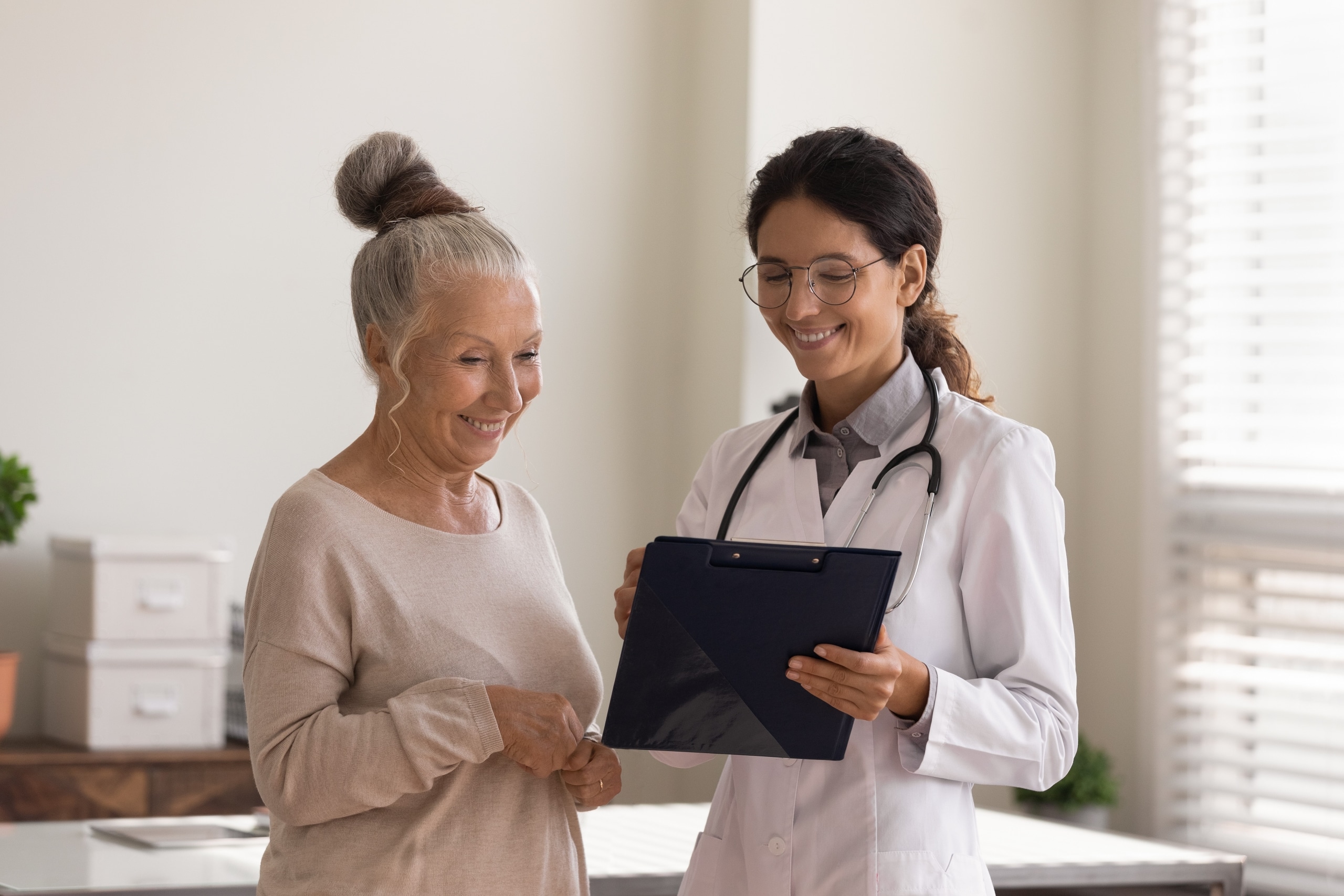 Medical professional with an elderly patient