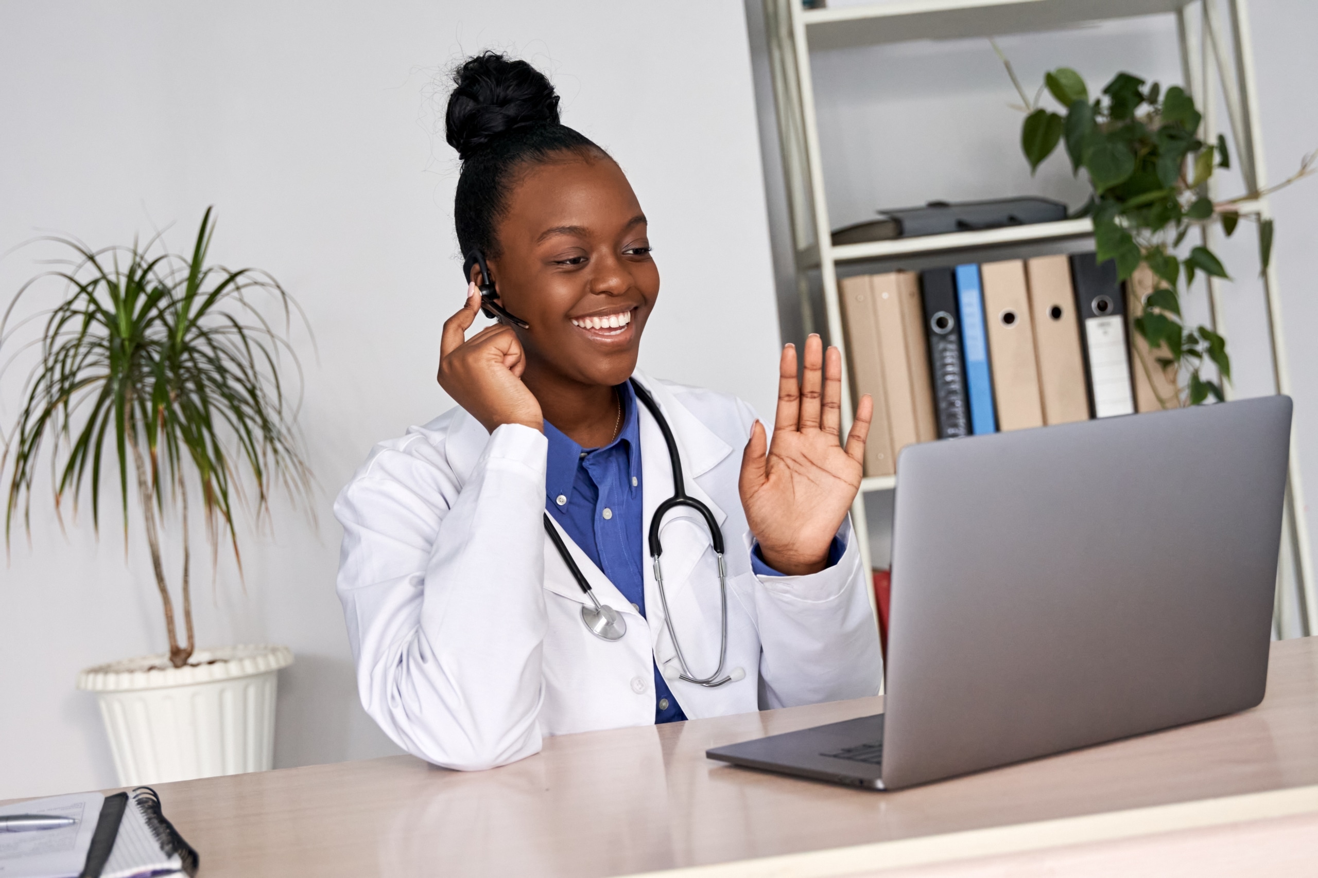 Medical professional using a headset for telehealth