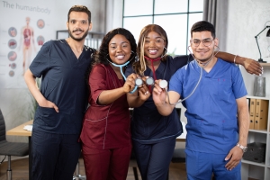 Smiling hospital medical staff holding stethoscopes