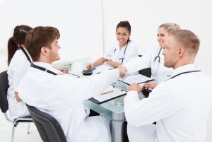 Group of medical professionals at a conference table