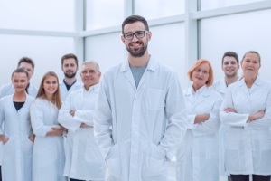 Group of smiling medical professionals in white coats