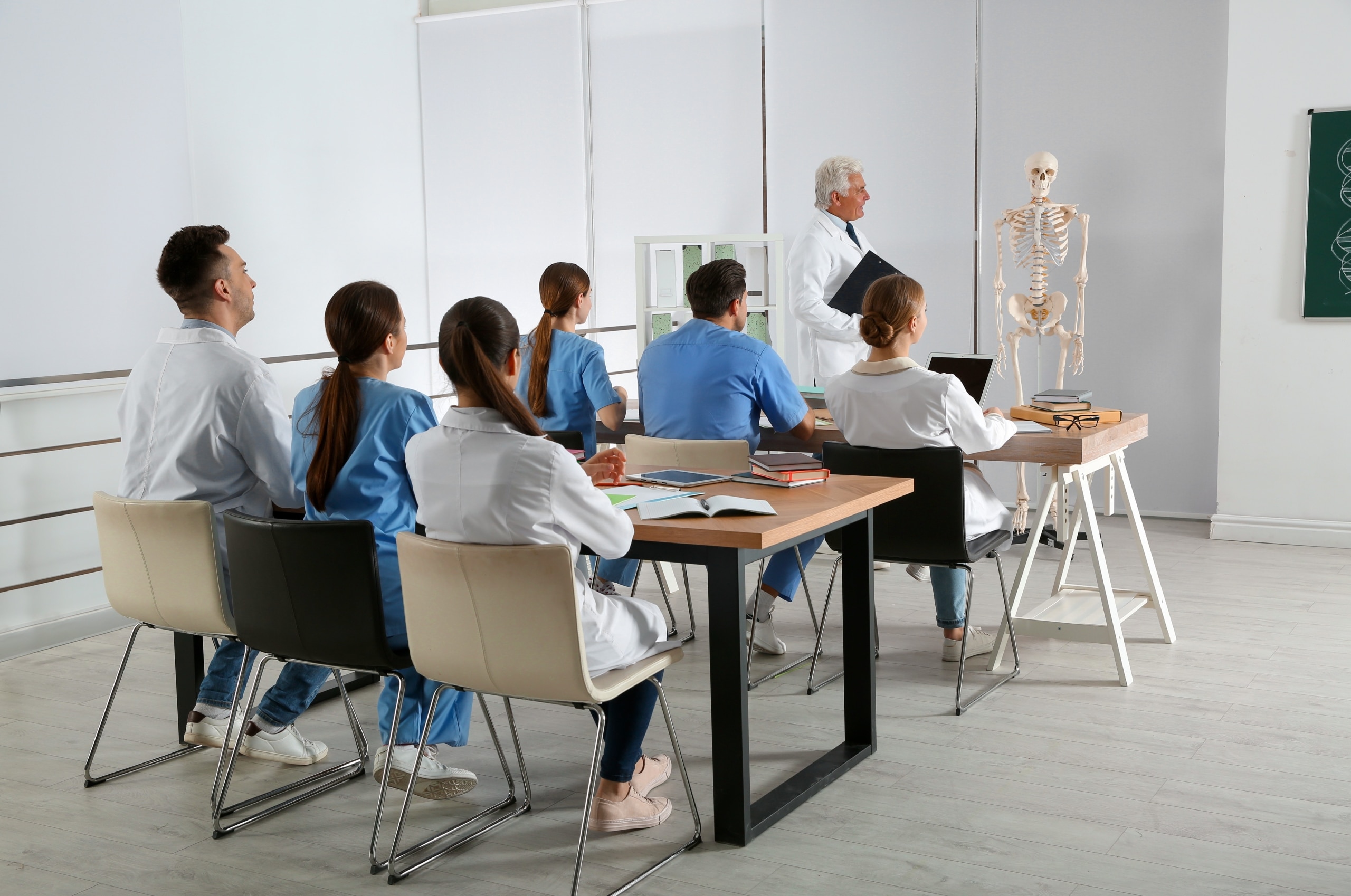 Medical students in a classroom listening to a lecture