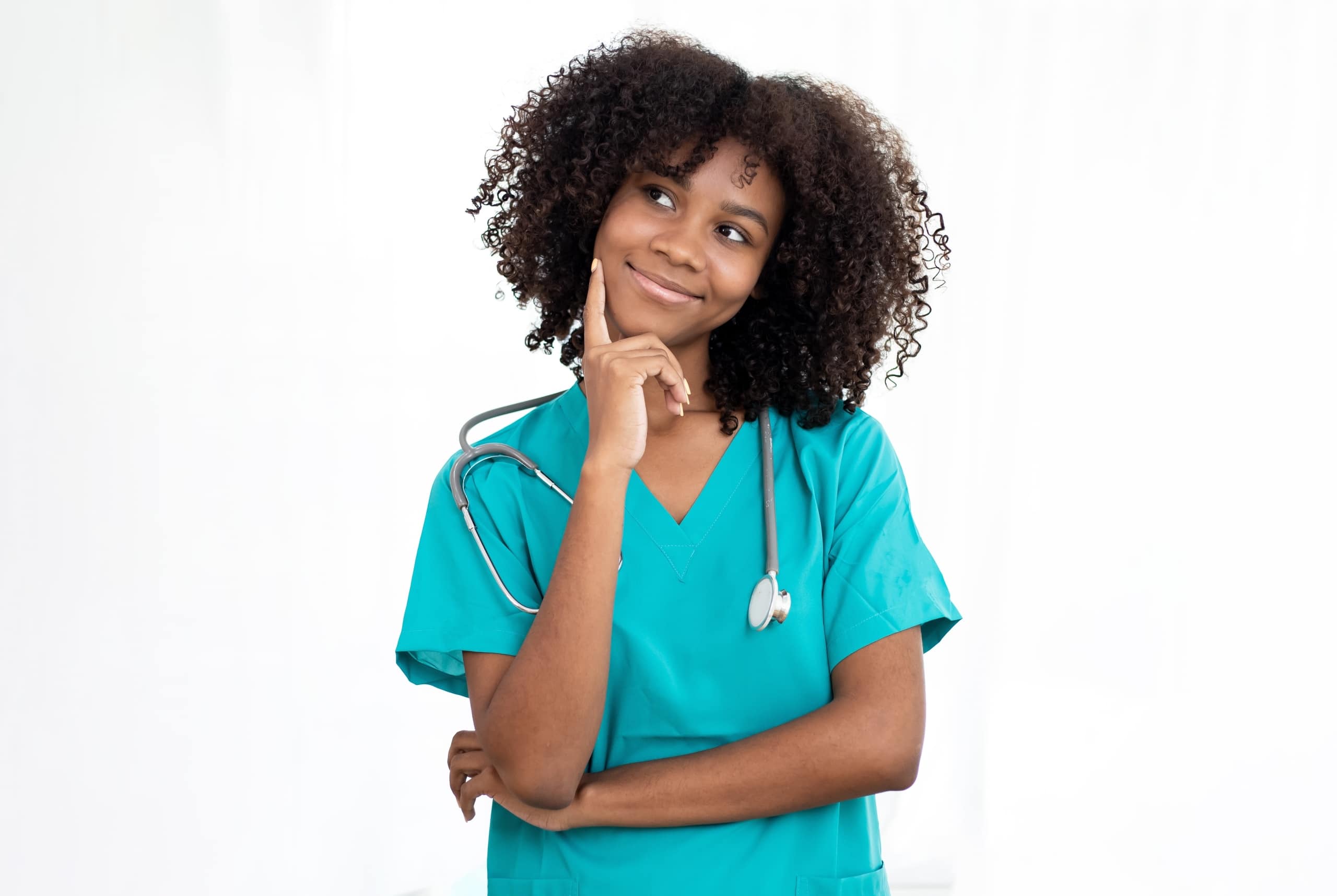 Female African-American nurse touching her chin in a considering pose