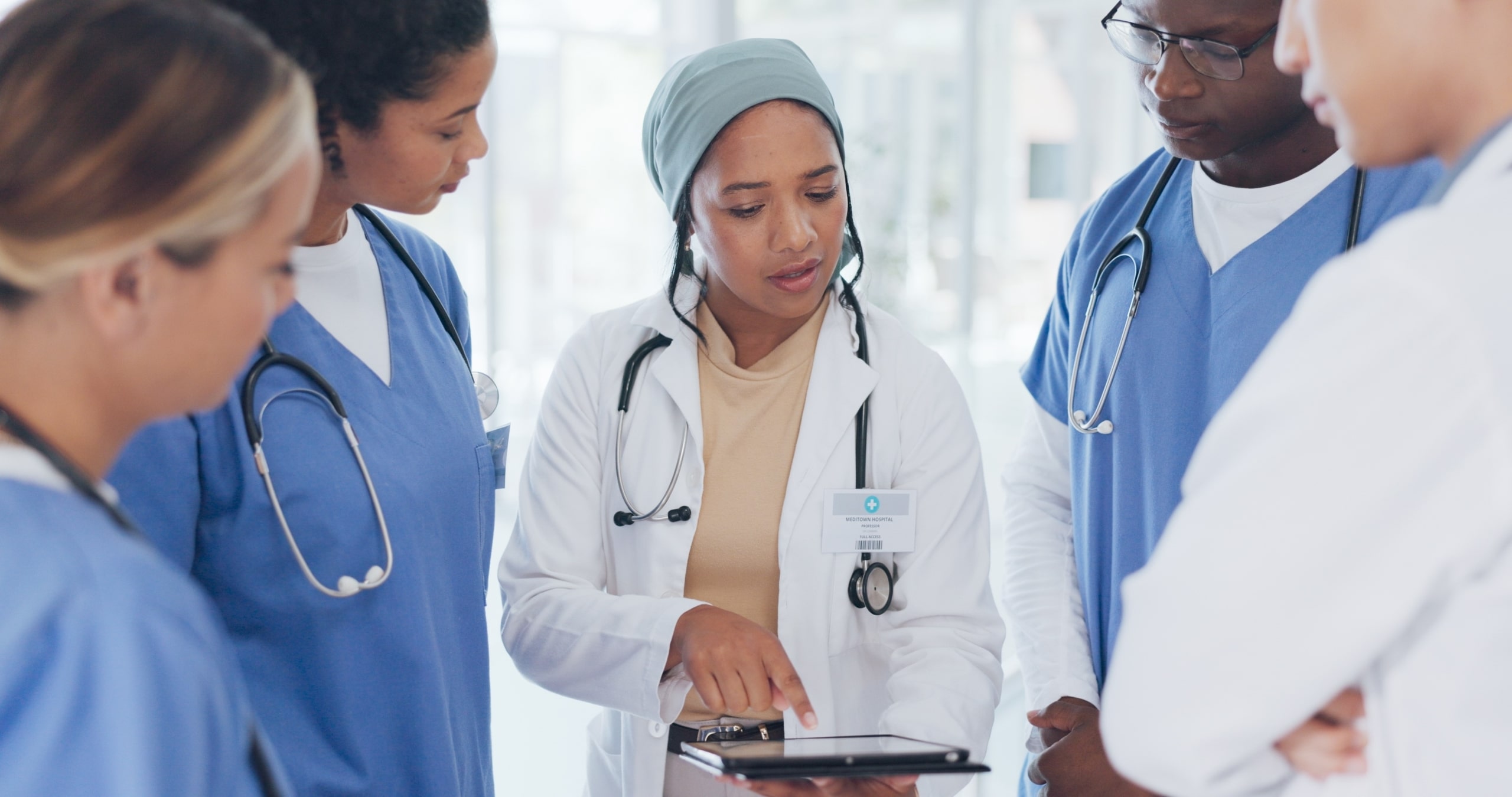 Female nurse leading a group of other nurses