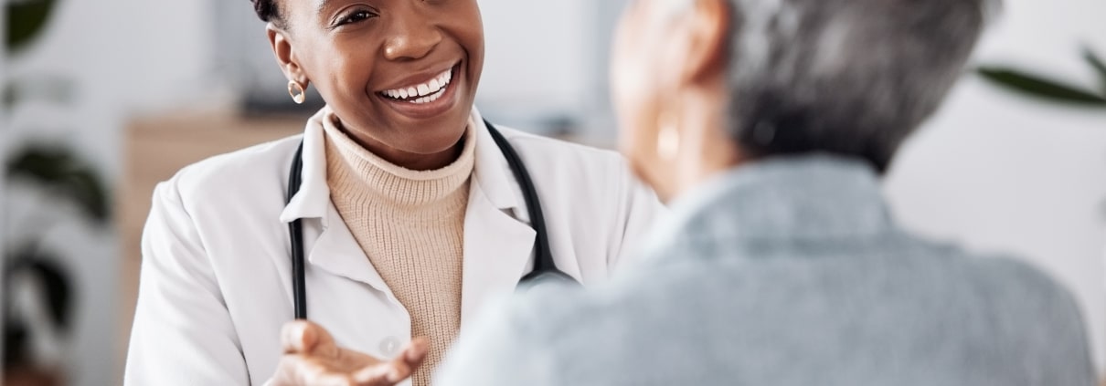African-American professional speaking with a patient