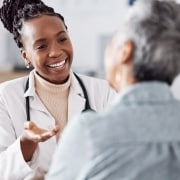 African-American professional speaking with a patient