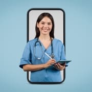 Nurse in scrubs standing in the frame of a smart phone