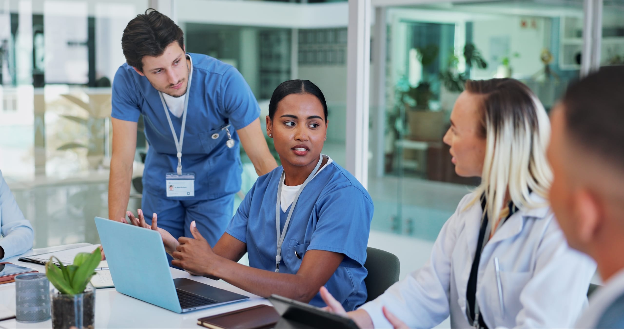 Group of diverse medical professionals at a conference table