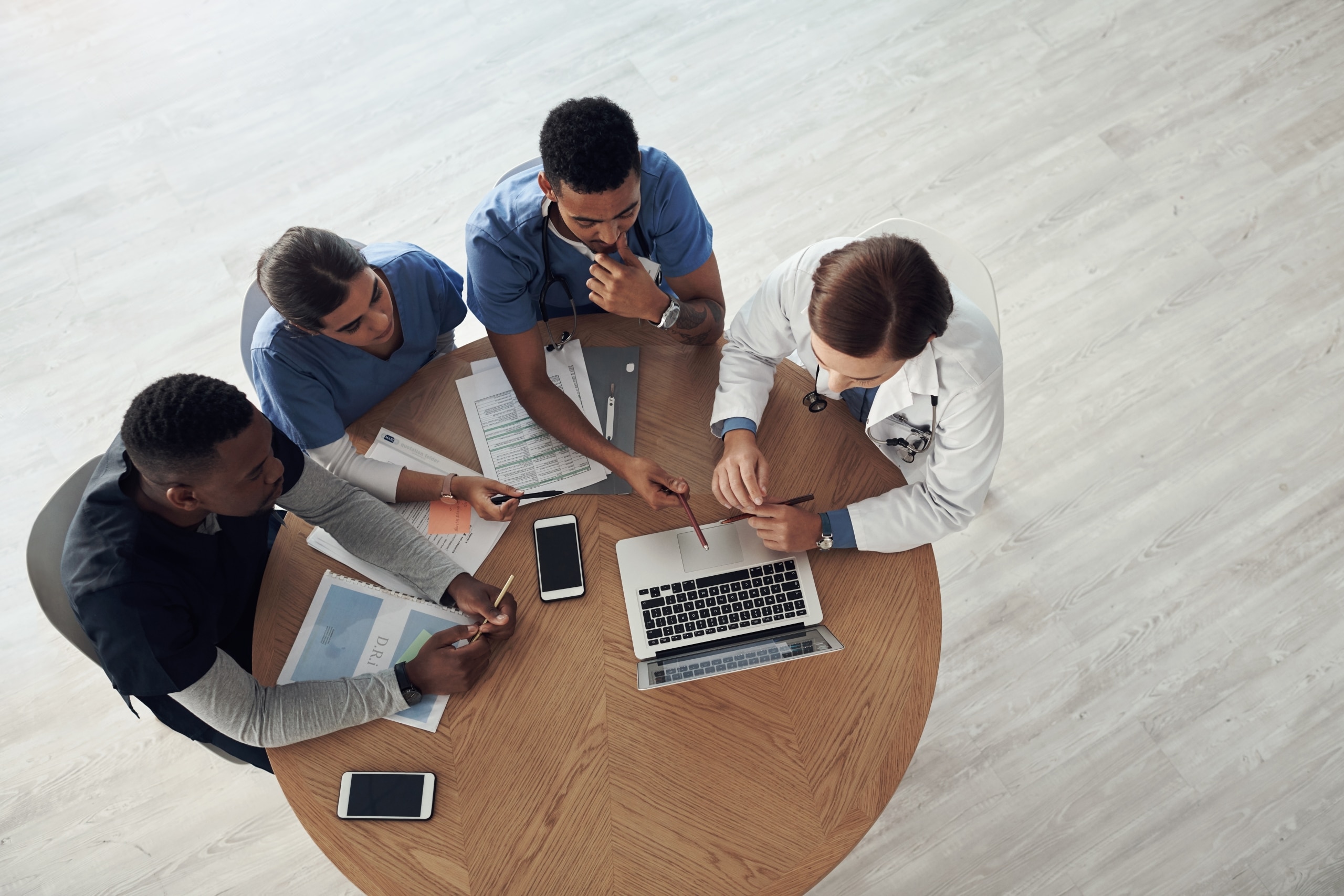 Aerial view of medical students sitting at a round table